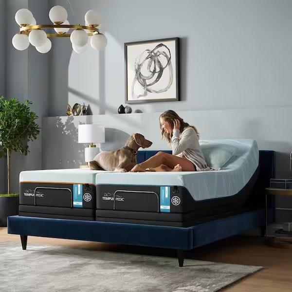 Woman relaxing on a Tempur-Pedic mattress on an adjustable base